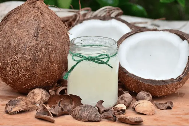 coconuts and oil on table