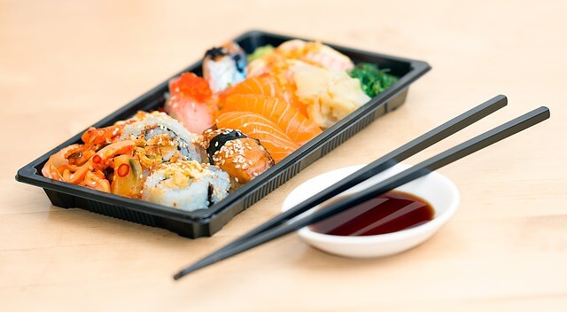 sushi on table with chopsticks