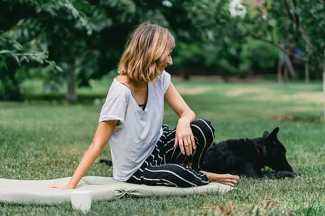 woman and dog in park